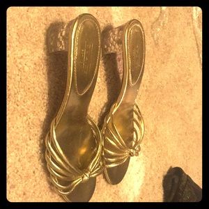 Metallic Gold and clear Coach sandals